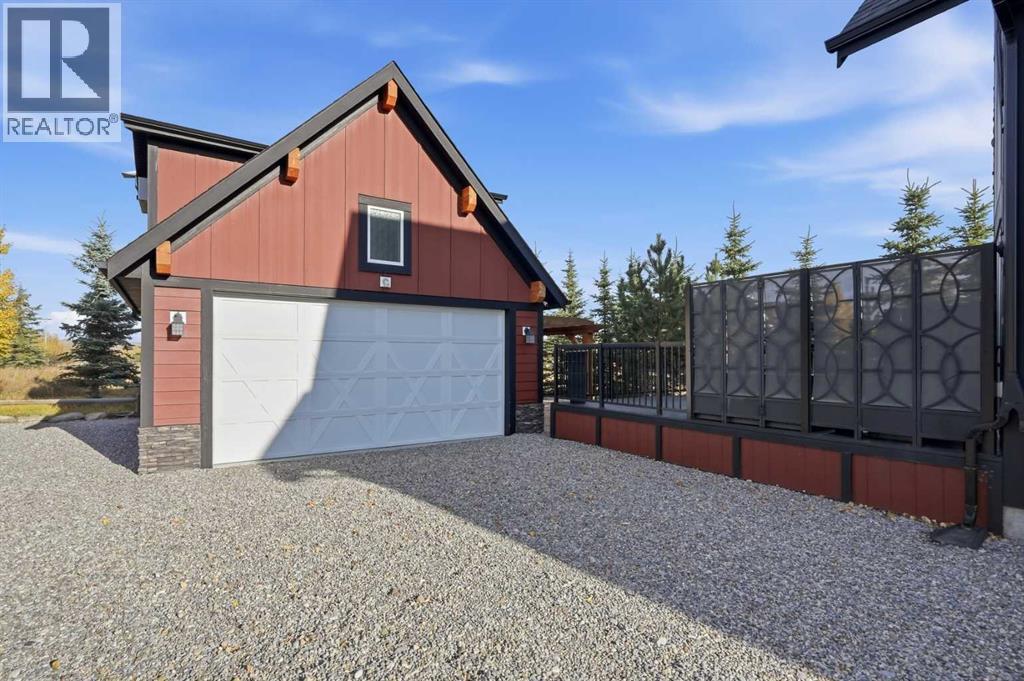 210 Cottageclub Crescent, Rural Rocky View County, Alberta  T4C 1B1 - Photo 29 - A2351102