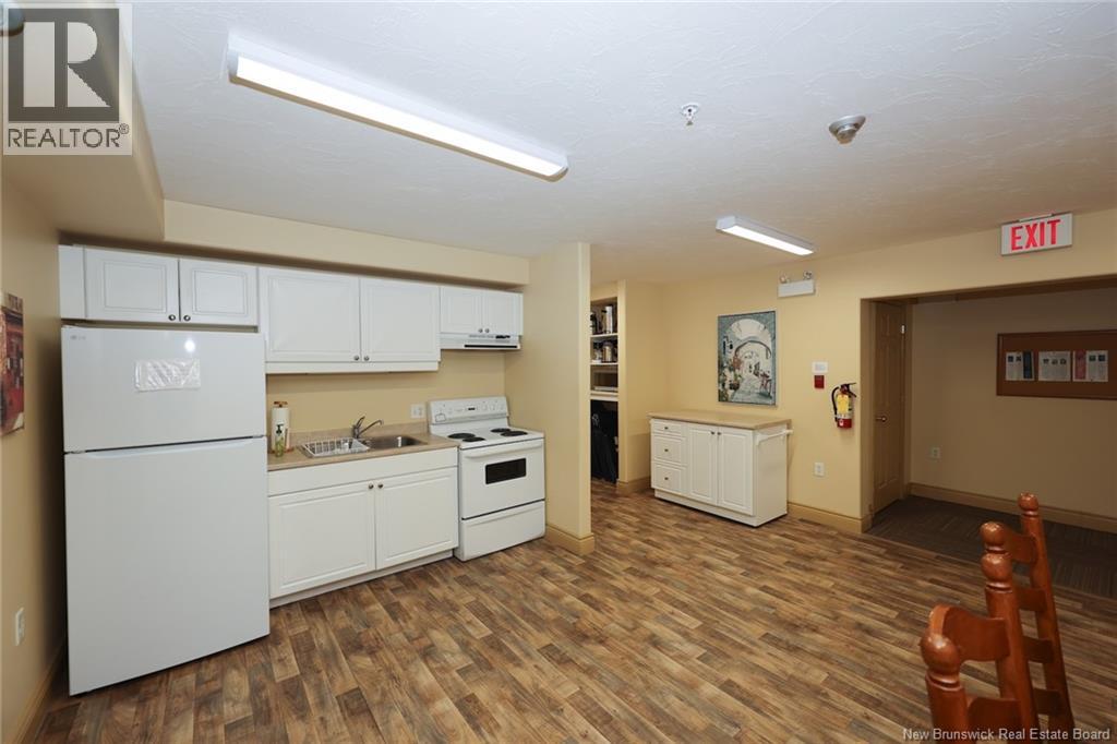 1 Golf Greens Lane Unit# 213, Fredericton, New Brunswick  E3B 9T9 - Photo 24 - NB149923