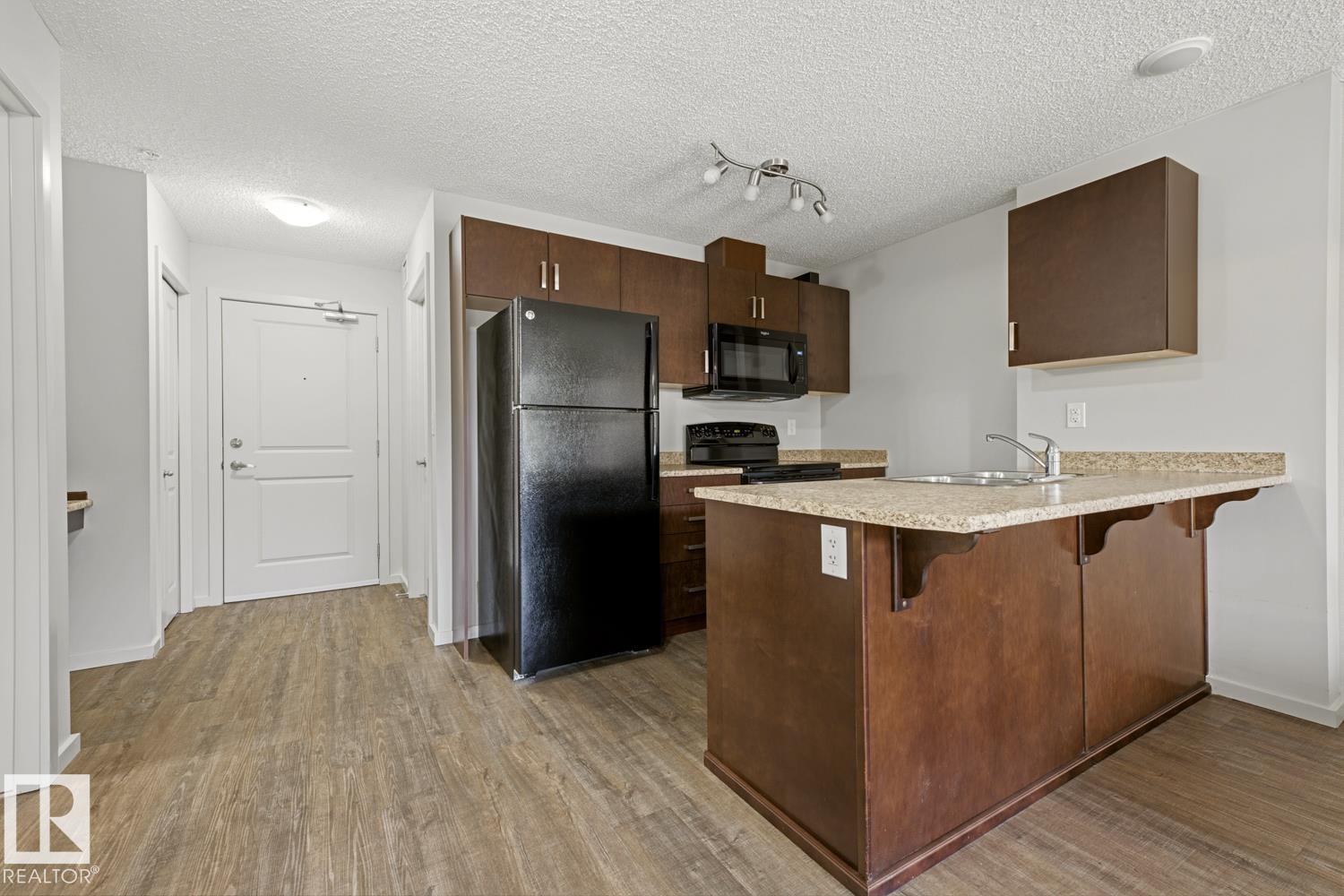 #303 5521 7 AV SW