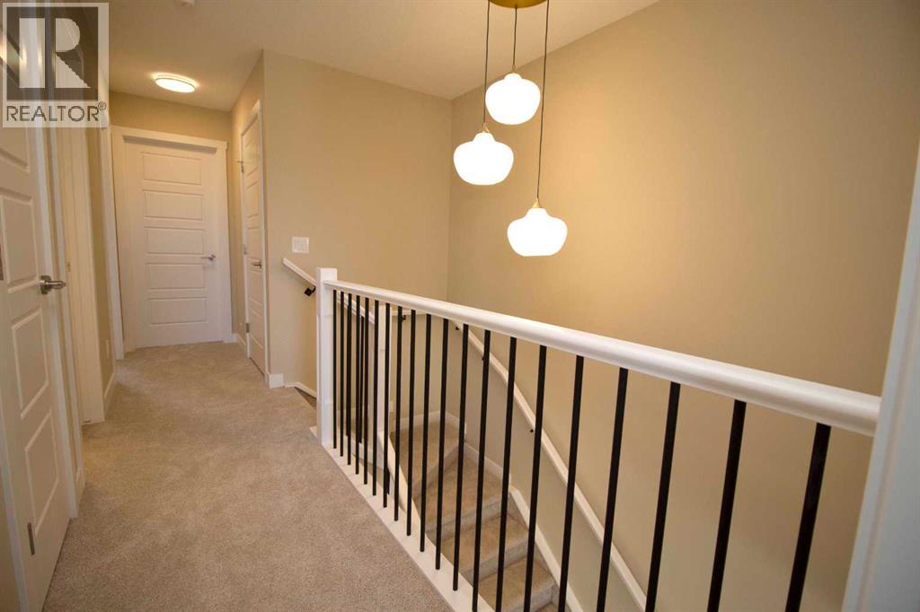 20 Sundown Place, Cochrane, Alberta  T4C 3H2 - Photo 10 - A2350109