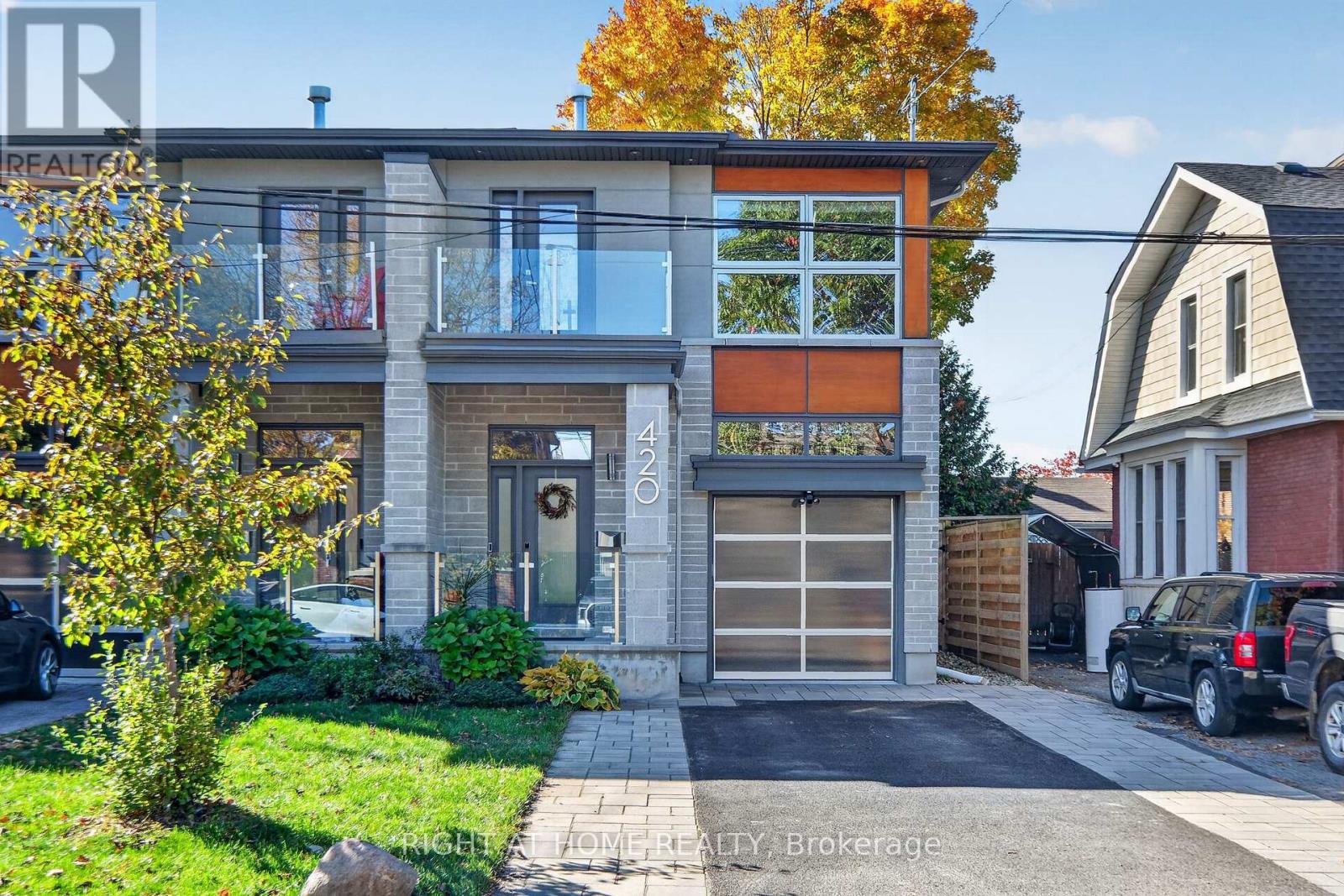 Welcome to your new modern dream home at 420 Athlone, perfectly situated in the heart of highly desirable Westboro, just steps from the vibrant shops, restaurants, and amenities of Richmond Road! This stunning, high-end three-story semi-detached home features 3 bedrooms and 4 bathrooms, crafted with the highest quality finishes and extreme attention to detail throughout. The open-concept main level is designed for effortless entertaining, showcasing an expansive living and dining area anchored by a cozy gas fireplace, alongside a chef-inspired kitchen equipped with premium stainless steel appliances, a built-in oven/microwave, a gas stove, a wine fridge, and a reverse osmosis drinking water system. Step through the patio doors into your private, fully landscaped, and maintenance-free backyard oasis-ideal for relaxing or outdoor gatherings. Ascend the striking glass-encased floating staircase to the upper level, where you will find a luxurious primary retreat complete with a walk-in closet, a 5-piece spa-like ensuite, a second gas fireplace, and a private balcony. Two additional spacious bedrooms with walk-in closets, a full bathroom, and convenient top-floor laundry complete this level. The fully finished basement expands your living space with a massive, plushly carpeted games/theatre room featuring a third gas fireplace, another full bathroom, and abundant storage space. Additional modern comforts include a whole-home water purification system and a central vacuum system for ultimate convenience. Exceptional luxury, style, and incredible location await you! Book your showing today! (id:48254)
