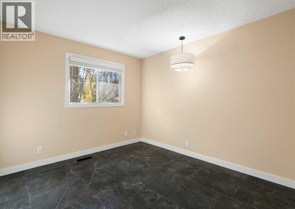 7132 Bow Crescent NW, Calgary, Alberta  T3B 2B9 - Photo 19 - A2353913