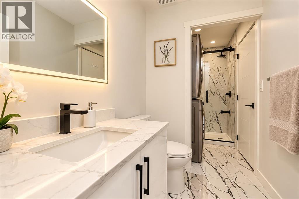 133 Woodbrook Road SW, Calgary, Alberta  T2W 6C6 - Photo 4 - A2354126