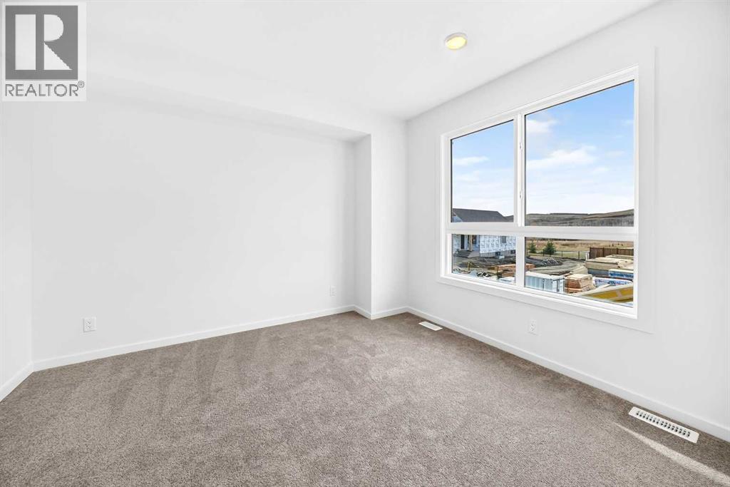 84 Creekside Rise SW, Calgary, Alberta  T2X 6G8 - Photo 26 - A2353868