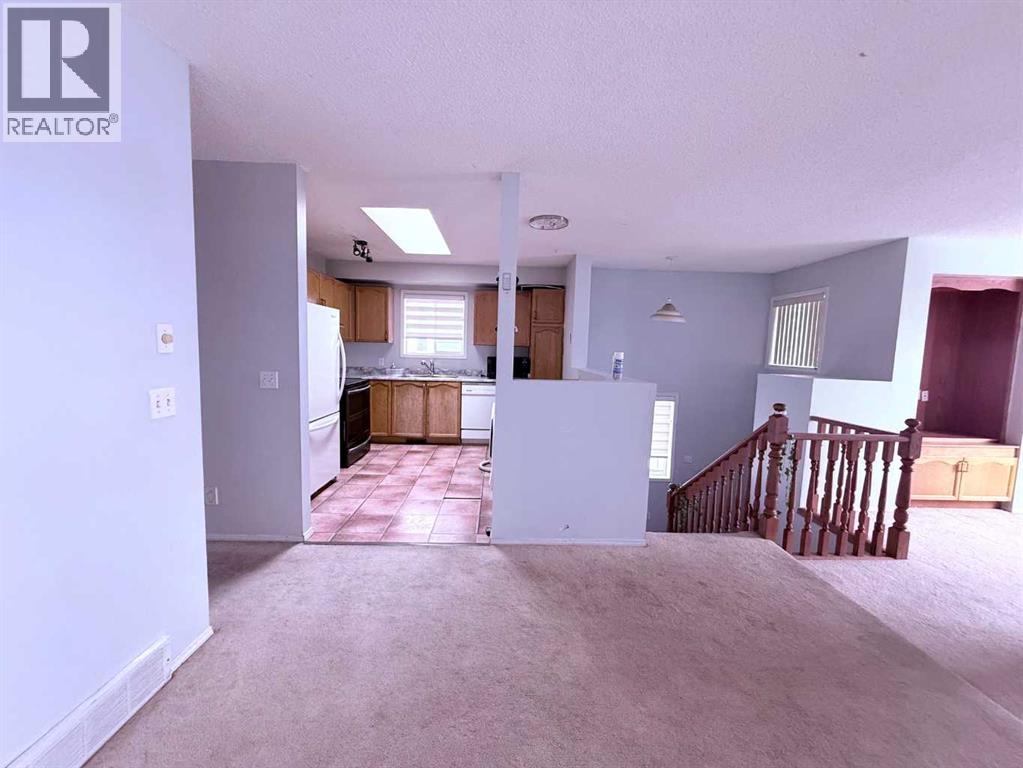 39 Tararidge Court Ne, Calgary, Alberta  T3J 2P9 - Photo 5 - A2353234