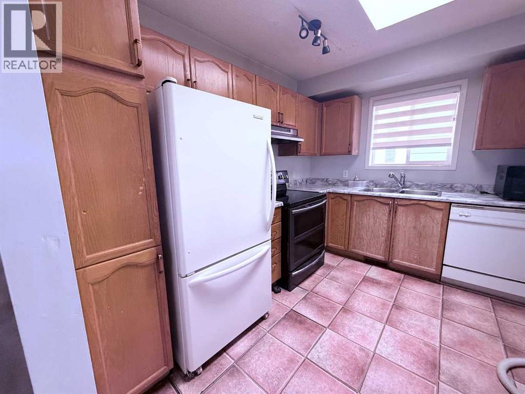 39 Tararidge Court Ne, Calgary, Alberta  T3J 2P9 - Photo 6 - A2353234