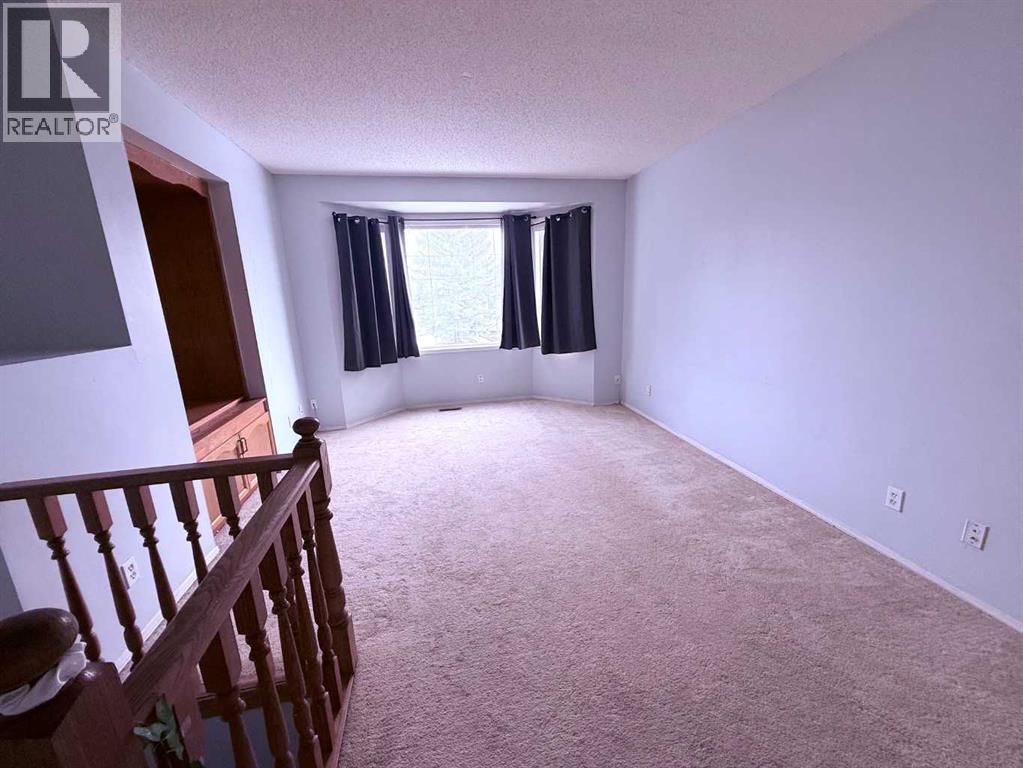 39 Tararidge Court Ne, Calgary, Alberta  T3J 2P9 - Photo 3 - A2353234
