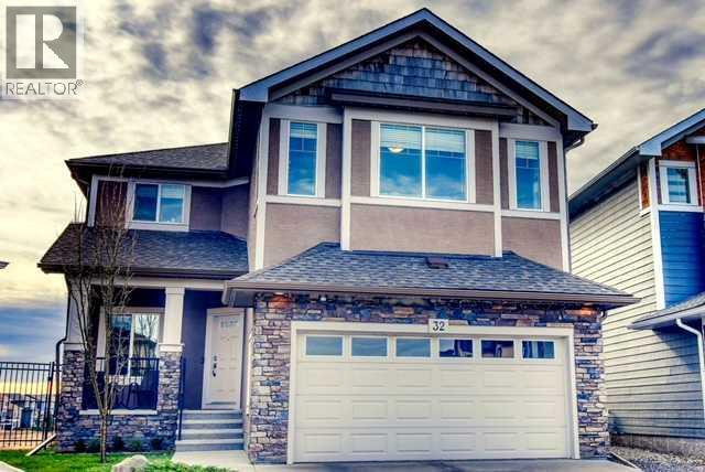 Beautifully positioned on a quiet cul-de-sac, this exceptional home offers a rare opportunity to own one of the few coveted south-facing ravine lots, offering a unique setting and exceptional appeal. Set on a large pie-shaped lot backing onto walking paths and natural green space, this impressive 2-storey home pairs inviting indoor spaces with exceptional outdoor living. A charming front porch invites peaceful morning coffees before stepping inside to a thoughtfully designed main floor with rich hardwood flooring and an inviting front den, ideal for a quiet home office or study. The open-concept layout unfolds into a spectacular open-to-above living room, where a soaring full-height stone fireplace makes a striking focal point and oversized windows frame the picturesque surroundings. Entertaining comes naturally in the chef's kitchen, complete with granite countertops, premium KitchenAid appliances, a gas stove and an expansive island with casual breakfast bar seating. Adjacent dining space is encased in windows, bringing beautiful views to every meal. A walk-through pantry simplifies grocery unloading, while a mudroom with built-in storage, convenient powder room and main floor laundry keep busy households organized. An open-to-below office nook on the upper level adds another flexible workspace, complemented by a spacious bonus room ideal for movie nights, hobbies or family gatherings. Wake up to beautiful views from the primary retreat, where a generous ensuite invites relaxation with dual vanities, a deep soaker tub and separate shower. 2 additional bedrooms and a 4-piece bathroom complete the upper level. Downstairs, the fully finished walkout basement is designed for entertaining, boasting a large pub-style bar with a striking feature wall, expansive island with seating and a dedicated wine canteen, perfect for convening with friends and family. Gather for games or movies in the generous recreation room, with a 4th bedroom, stylish bathroom and ample storage r ounding out this versatile space. The upper composite deck is ideal for barbecuing and taking in the scenery, while the lower patio with pergola and solar lighting extends your outdoor enjoyment. The expansive south-facing backyard is a standout feature, offering abundant sunshine and a rare connection to the surrounding ravine landscape. Additional highlights include an insulated and drywalled double attached garage, air conditioning, dual furnaces, dual humidifiers and permanent outdoor lighting. Recent improvements bring added peace of mind with a new roof, eaves and downspouts in 2025, Electrolux washer and dryer in 2024 and a KitchenAid dishwasher in 2026. With parks, playgrounds, pathways and K-9 schools within walking distance, this move-in-ready home delivers a wonderful balance of space, scenery and everyday convenience in an extremely welcoming community. (id:48254)